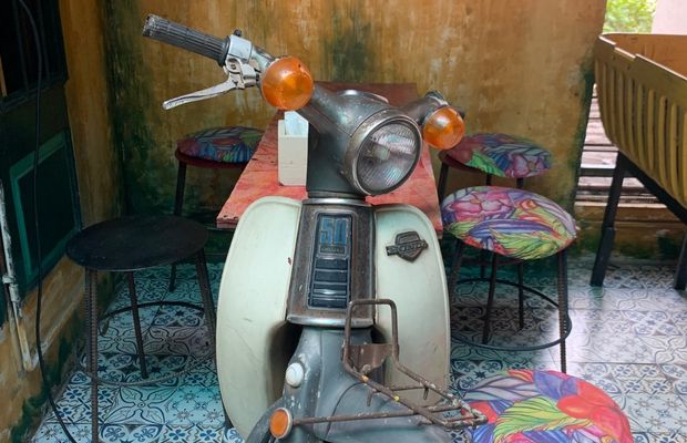 Old motorbike is used as table at Hidden Gem Cafe